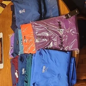 A LARGE BUNDLE OF PLUS SIZE SCRUBS. 3X 4X  ONE 2X.